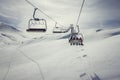 Warth,Austria,Skilifts in the mountains with sun, clouds and fresh snow Royalty Free Stock Photo