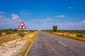 Warthogs crossing warning road sign placed along a road in Namibia