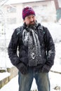 Wary man standing in a snowy garden Royalty Free Stock Photo