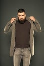 He was born stylish. Stylish hipster on grey background. Bearded man get dressed with brutal stylish look. Casual but