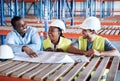 It was just a dream until they came along. a group of builders having a meeting at a construction site. Royalty Free Stock Photo