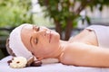 That was just what she needed. a woman in a day spa relaxing on a massage table.