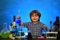 It was a little chemistry experiment. Science. Lab microscope and testing tubes. Child from elementary school. schoolboy Royalty Free Stock Photo