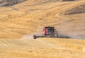 Harvesting wheat in the hills of Wasco county Oregon Royalty Free Stock Photo