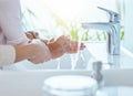 Wash all the germs away. an unrecognizable parent helping their child wash their hands at home. Royalty Free Stock Photo