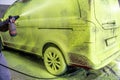 wash car with green active foam on a hand washer Royalty Free Stock Photo