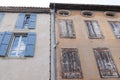 Wash cleaned house facade and a dirty one in a city center town