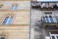 Before and after between a wash cleaned house facade and a dirty one in a city center