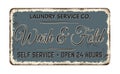 Wash and fold vintage rusty metal sign