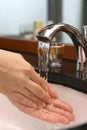 Wash hand at sink Royalty Free Stock Photo