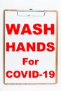 Wash Hanss for Covid-19 signage on note Royalty Free Stock Photo