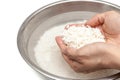 Wash rice with water in the stainless bowl Royalty Free Stock Photo