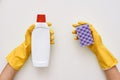 Wash the stove. Cleaning agent and sponge in human hands Royalty Free Stock Photo