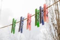 Wash things. clothesline. Clothes pegs. Drying things. Multi-colored clothespins. The photo is suitable for sites selling detergen Royalty Free Stock Photo