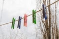 Wash things. clothesline. Clothes pegs. Drying things. Multi-colored clothespins. The photo is suitable for sites selling detergen Royalty Free Stock Photo