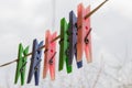 Wash things. clothesline. Clothes pegs. Drying things. Multi-colored clothespins. The photo is suitable for sites selling detergen Royalty Free Stock Photo