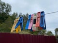 Wash things. clothesline. Clothes pegs. Drying things. Multi-colored clothespins. The photo is suitable for sites selling detergen Royalty Free Stock Photo