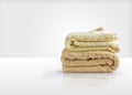 Wash towels on a white table, symbolizes the Laundry