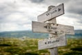 wash your hands text engraved on old wooden signpost outdoors in nature Royalty Free Stock Photo