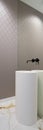 Washbasin with black tap in mirror wall, vertical panorama Royalty Free Stock Photo