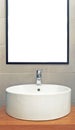 Washbasin in modern bathroom with mirror on the wall Royalty Free Stock Photo