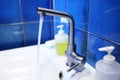 Washbasin tap with stainless steel waste Royalty Free Stock Photo