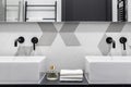 Elegant washbasins with black faucets Royalty Free Stock Photo