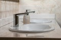 Washbasins with nickel-plated taps and thick stone tops