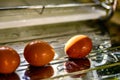 Washed clean eggs on sink drainer in kitchen Royalty Free Stock Photo