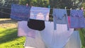 Washed clean laundry hanging on the rope or clothesline drying in the wind outdoors Royalty Free Stock Photo
