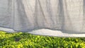 Washed clean laundry hanging on the rope or clothesline drying in the wind outdoors