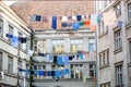 Washed clothes drying outside of an old house. Washed clothes drying. Fresh clean clothes are drying outside. Clothes