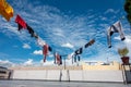 Washed clothes hanging on lines on a sunny day with beautiful blue skies and white clouds in the background. India Royalty Free Stock Photo