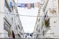 Washed clothes hanging between residencial buildings in Ayamonte, Spain