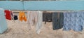 Washed cloths hanging to dry in sunshine