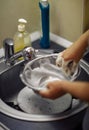 Washed Dishes- close up hands washing dishes Royalty Free Stock Photo