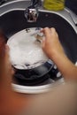 Washed Dishes- concept of woman washing dishes in the kitchen Royalty Free Stock Photo