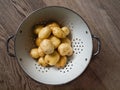 Washed new potatoes in a collander Royalty Free Stock Photo