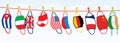 Washed Protective Face Masks Hanging on a Line. Drying Laundered Reusable Masks with Flags of Different Countries