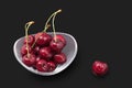 Washed sweet cherries on a black background. Prunus avium Royalty Free Stock Photo
