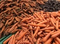 Washed and unwashed carrots with beet, vegetables concept