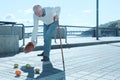 Washed up man dropping groceries during walk