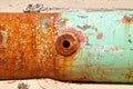 Barnacle covered rusty pipe