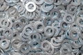 Washers for the bolt. Texture. Many washers for bolts and screws. Background for wallpaper. Shim. Spacer Royalty Free Stock Photo