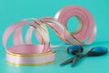 Washi tape rolls, masking tape rolls in pile. Pink tones