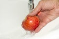 Washing apple. Healthy eating concept. Red Apple Royalty Free Stock Photo