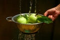 washing apples in the colander