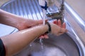 Washing arms and wrist properly. Hygiene concept. Wet hands