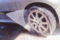 Washing car with pressure washer at self-service car wash station Royalty Free Stock Photo