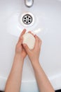 Washing child`s hands with antibacterial soap over the white sink. Protection against bacteria, coronavirus Royalty Free Stock Photo